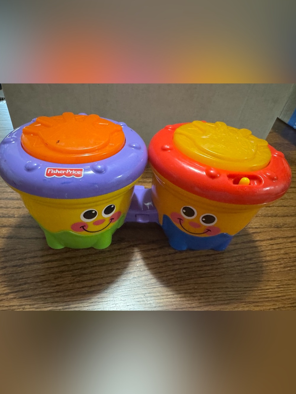 Fisher-Price Dual Smiling Drum Toy in Yellow, Purple, Red, Orange